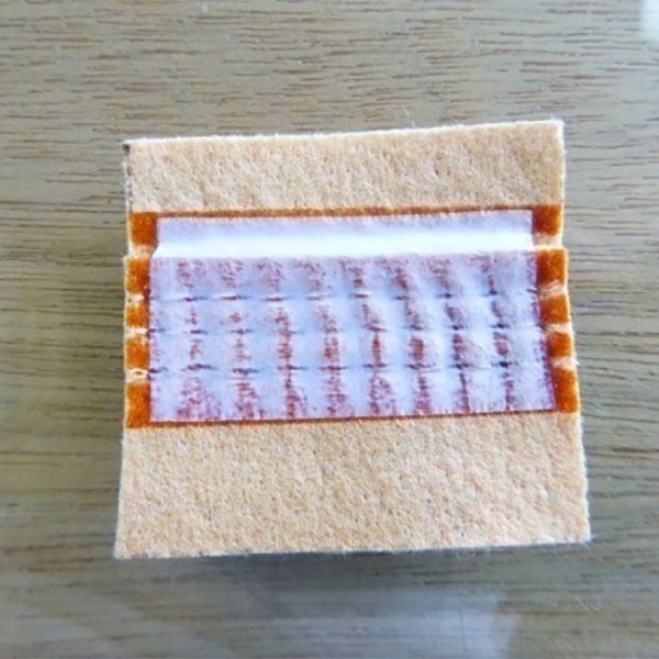 Opțiuni pentru prevenirea scurgerilor de pungi de filtrare în centralele electrice pe cărbune: Comparația procesului de acoperire adezivă și procesul de aplicare a benzii PTFE